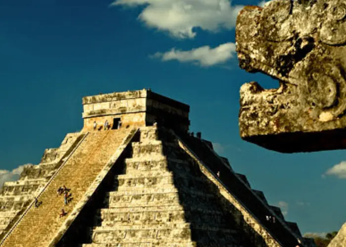 mayan god kulculan statue and infront of pyramid