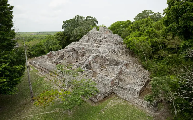 Nohoch Mul Pyramid surrounded by jungle at Coba, an ancient Mayan site near Cancun.