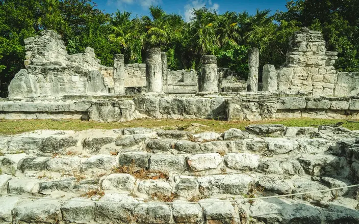 El Rey archaeological zone in Cancun’s Hotel Zone, featuring ancient Mayan ruins and iguanas.